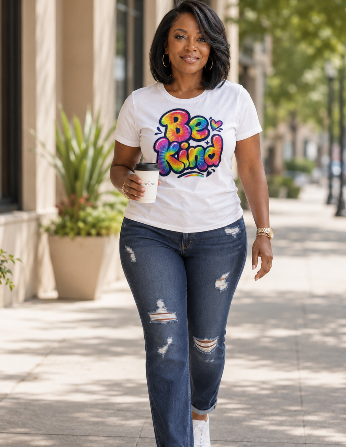 Women's Be Kind statement tee with vibrant tie dye design