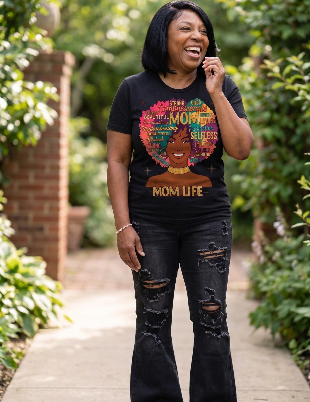 Women's Black motherhood graphic tee with colorful Afro design